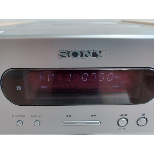 559 - A Sony HCD-GPX5 micro hi-fi system comprising cassette deck, radio and CD player with a pair of matc... 