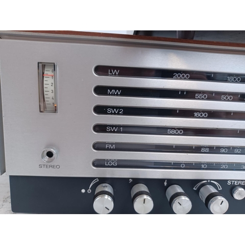 563 - Two items of vintage hi-fi, one Bush TA2800 Arena four band receiver and one Trio KT-1000A solid-sta... 