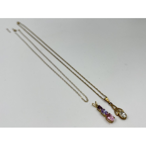 1071A - Two 9ct gold gemstone pendant necklaces, one clear gemstone Celtic design and one pink and purple tr... 