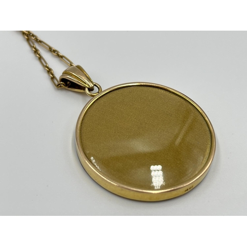 1051 - A late 19th/early 20th century 15ct gold photo locket pendant necklace with miniature hand painted p... 