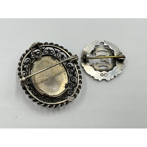 1055 - Six various silver pin brooches and badges to include Victorian hallmarked Birmingham horse shoe and... 