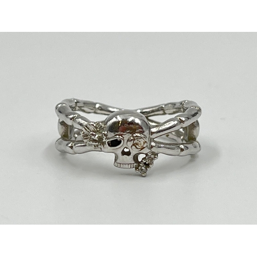 1056 - Four silver rings comprising oval abalone, .925 carnelian, and two .925 CZ stone - approx. gross wei... 