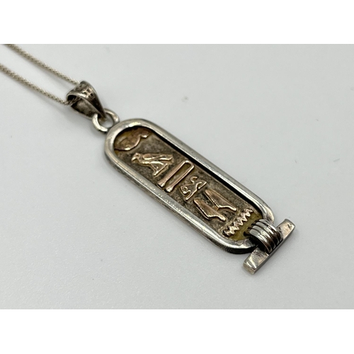 1061 - Two .925 silver pendant necklaces comprising Ancient Egyptian style hieroglyphs and British bulldog ... 