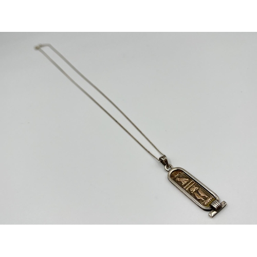 1061 - Two .925 silver pendant necklaces comprising Ancient Egyptian style hieroglyphs and British bulldog ... 