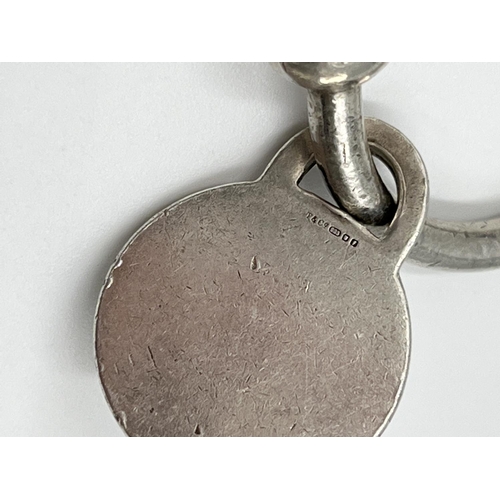 1062 - A Tiffany & Co. hallmarked London silver key ring, dated 1961 stamped 'M17400' - approx. gross weigh... 