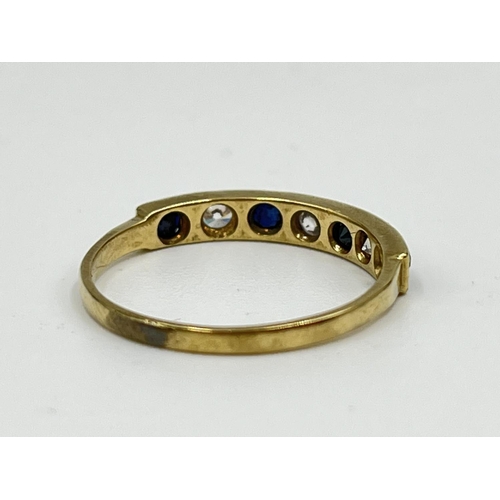 1064 - A hallmarked Birmingham 9ct gold CZ stone and sapphire half eternity ring, size N½ - approx. gross w... 