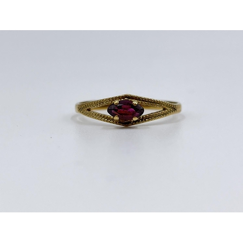 1065 - An 8ct gold garnet solitaire ring, size O½ - approx. gross weight 1.07 grams