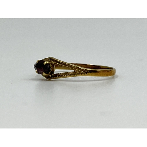 1065 - An 8ct gold garnet solitaire ring, size O½ - approx. gross weight 1.07 grams