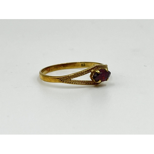 1065 - An 8ct gold garnet solitaire ring, size O½ - approx. gross weight 1.07 grams