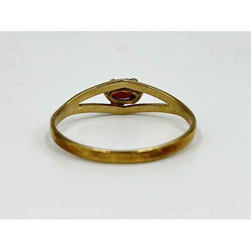 1065 - An 8ct gold garnet solitaire ring, size O½ - approx. gross weight 1.07 grams