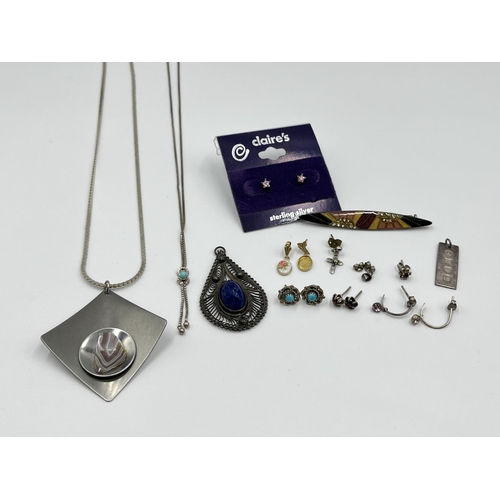 1070 - A collection of silver and white metal jewellery to include hallmarked Birmingham silver miniature i... 