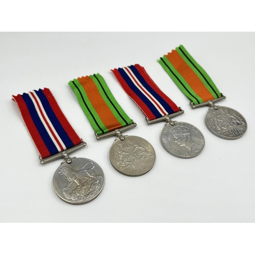 1105 - Two boxed WWII medal pairs with ribbons and papers, one box addressed to Mrs. R.M Barnett and one ad... 