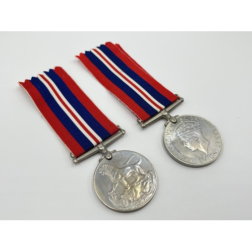 1105 - Two boxed WWII medal pairs with ribbons and papers, one box addressed to Mrs. R.M Barnett and one ad... 