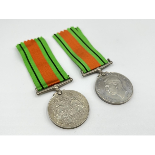 1105 - Two boxed WWII medal pairs with ribbons and papers, one box addressed to Mrs. R.M Barnett and one ad... 