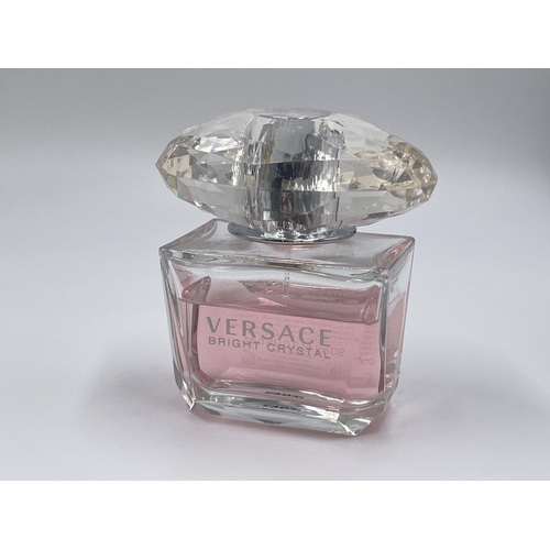 1163 - Three various fragrances, one Versace Bright Crystal 90ml eau de toilette, one Azzaro Wanted 100ml e... 