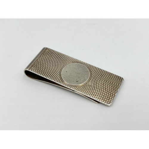 1167 - A hallmarked Birmingham silver money clip, dated 1983 - approx. gross weight 14.13 grams