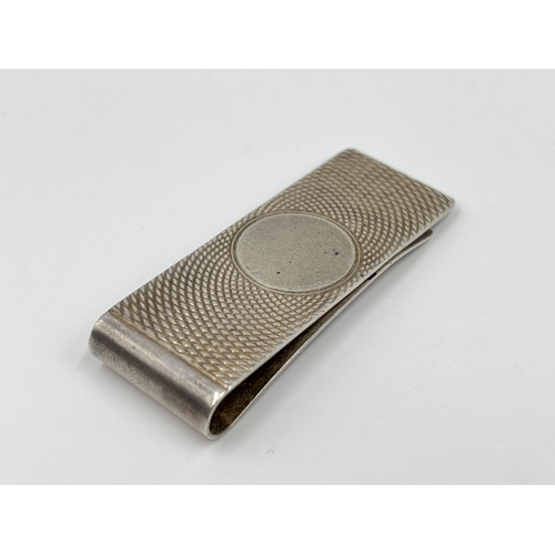 1167 - A hallmarked Birmingham silver money clip, dated 1983 - approx. gross weight 14.13 grams