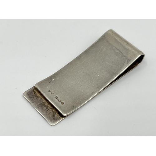 1167 - A hallmarked Birmingham silver money clip, dated 1983 - approx. gross weight 14.13 grams