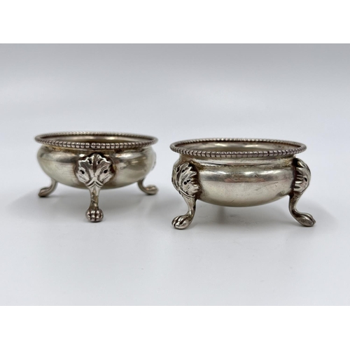 1209 - A pair of Victorian hallmarked Sheffield silver tri-footed salts, dated 1880 - approx. gross weight ... 