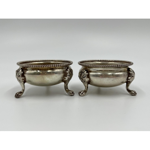 1209 - A pair of Victorian hallmarked Sheffield silver tri-footed salts, dated 1880 - approx. gross weight ... 