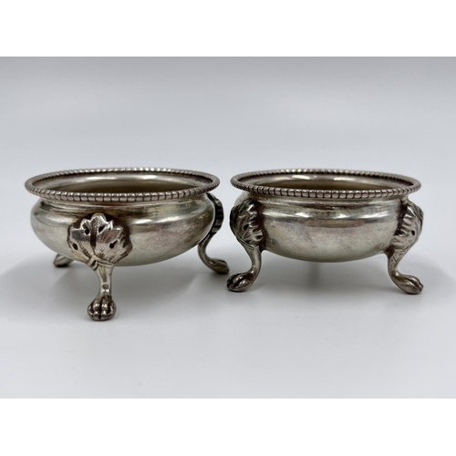 1210 - A pair of Victorian hallmarked Sheffield silver tri-footed salts, dated 1880 - approx. gross weight ... 