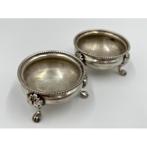 1210 - A pair of Victorian hallmarked Sheffield silver tri-footed salts, dated 1880 - approx. gross weight ... 