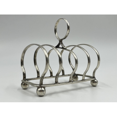 1215 - A William Batt & Sons Edward VII hallmarked Sheffield silver four section toast rack, dated 1903 - a... 