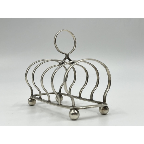 1215 - A William Batt & Sons Edward VII hallmarked Sheffield silver four section toast rack, dated 1903 - a... 