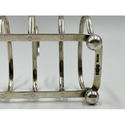 1215 - A William Batt & Sons Edward VII hallmarked Sheffield silver four section toast rack, dated 1903 - a... 