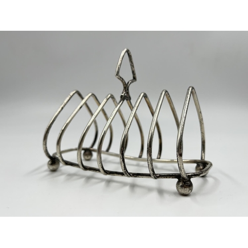 1217 - A George V hallmarked Birmingham silver six section toast rack, dated 1935 - approx. gross weight 97... 