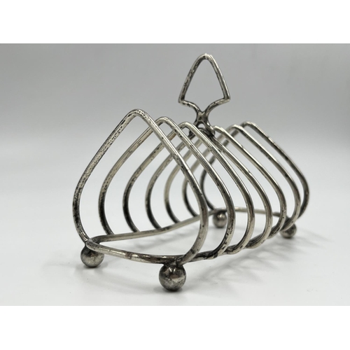 1217 - A George V hallmarked Birmingham silver six section toast rack, dated 1935 - approx. gross weight 97... 