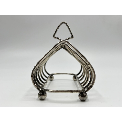 1217 - A George V hallmarked Birmingham silver six section toast rack, dated 1935 - approx. gross weight 97... 