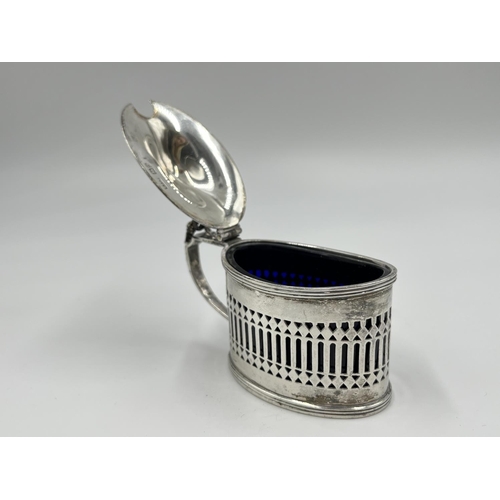 1219 - A Stokes & Ireland Ltd. George V hallmarked London silver mustard pot with pierced central decoratio... 