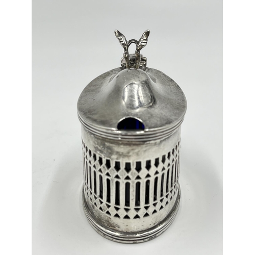 1219 - A Stokes & Ireland Ltd. George V hallmarked London silver mustard pot with pierced central decoratio... 