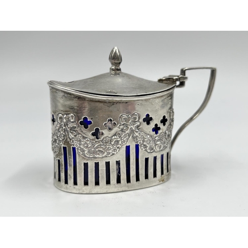 1220 - A William Aitkin Edward VII hallmarked Birmingham silver mustard pot with blue glass liner, dated 19... 