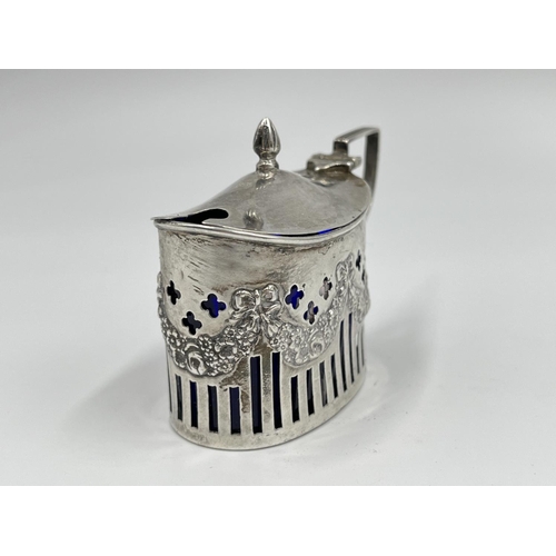 1220 - A William Aitkin Edward VII hallmarked Birmingham silver mustard pot with blue glass liner, dated 19... 