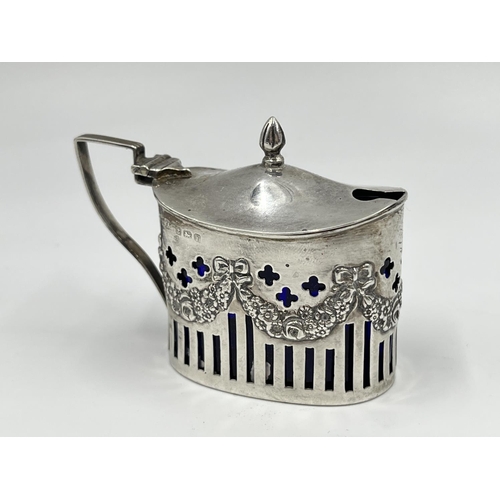 1220 - A William Aitkin Edward VII hallmarked Birmingham silver mustard pot with blue glass liner, dated 19... 