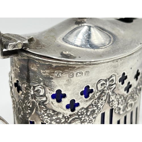 1220 - A William Aitkin Edward VII hallmarked Birmingham silver mustard pot with blue glass liner, dated 19... 