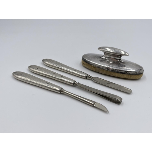 1231 - A Liberty & Co Ltd hallmarked Birmingham silver four piece women's manicure set, dated 1919