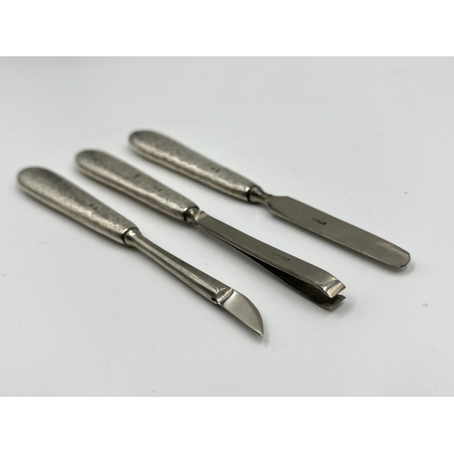 1231 - A Liberty & Co Ltd hallmarked Birmingham silver four piece women's manicure set, dated 1919