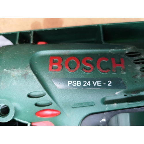 655 - A cased Bosch PSB 24VE-2 cordless hammer drill with battery, charger and instruction manuals