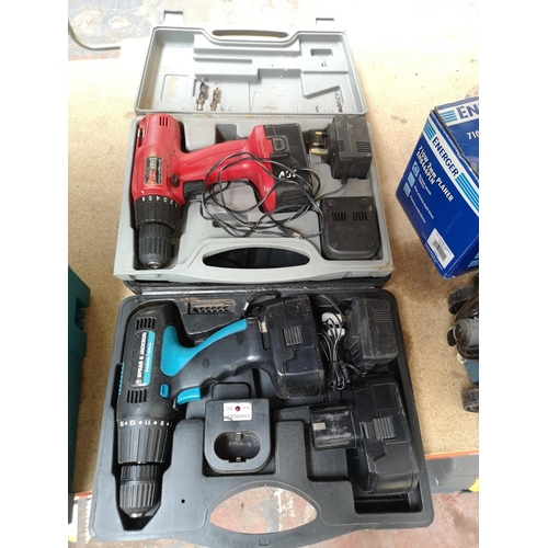 677 - Two cased cordless hammer drills with batteries and chargers, one Power Devil and one Spear & Jackso... 