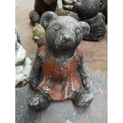 707 - A collection of cast stone animal garden ornaments to include fox, bears, squirrels etc.