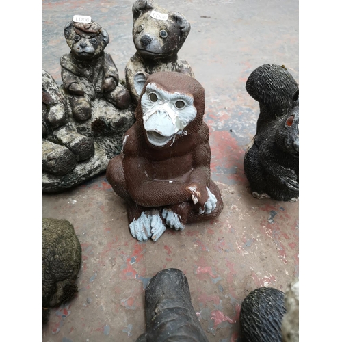 707 - A collection of cast stone animal garden ornaments to include fox, bears, squirrels etc.