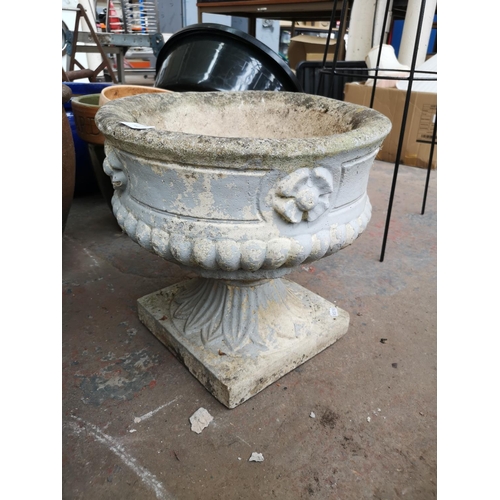 722 - Three cast stone garden items, two planters on pedestal base and one figural lady