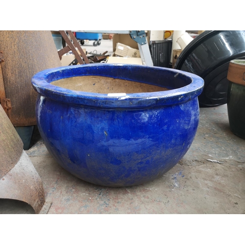 724 - A large glazed terracotta plant pot - approx. 32cm high x 51cm diameter