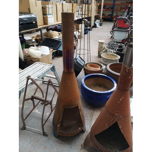 725 - Five items to include two chimeneas, outdoor candle lantern etc.