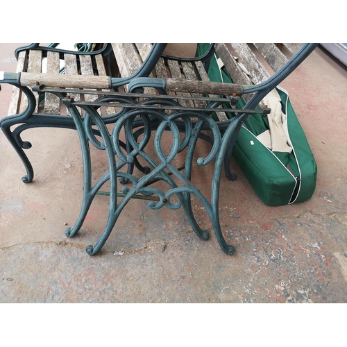 726 - Three matching items, two Victorian style cast iron and wooden slatted chairs and one pair of cast i... 