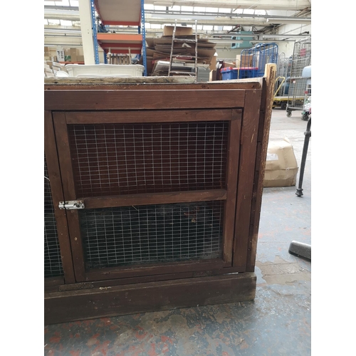 733 - Two items, one wooden rabbit hutch - approx. 76cm high x 118cm long x 60cm deep and one plastic dog ... 