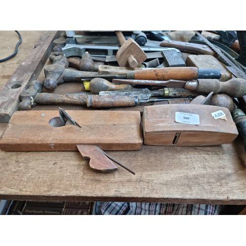 681 - A collection of assorted tools to include saws, wood planes, spirit levels, wood chisels etc.